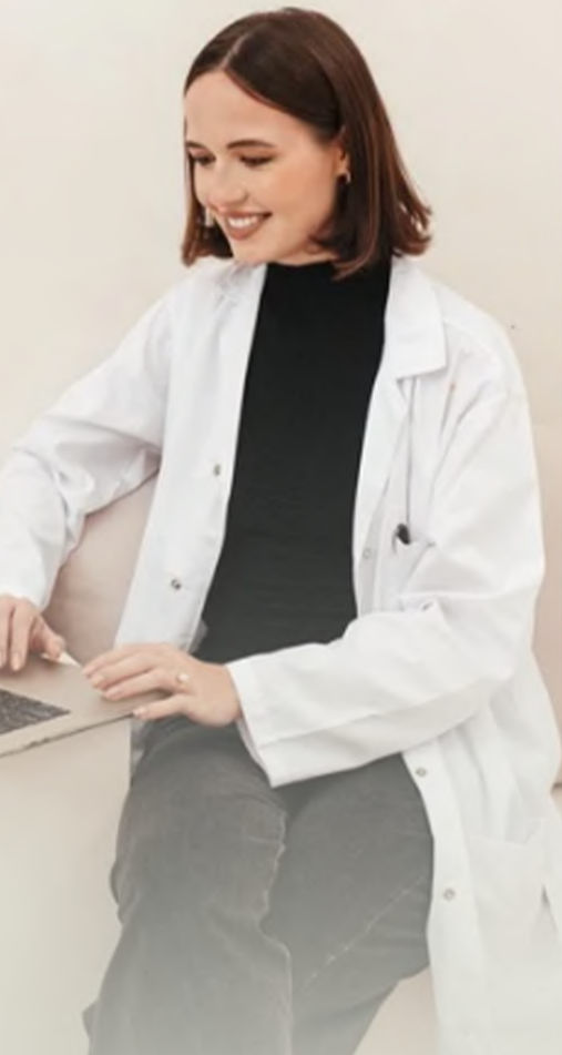 Mia working at her laptop